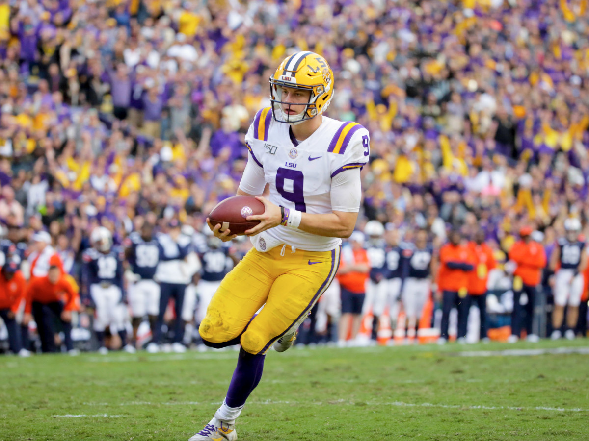 Oct 26, 2019; Baton Rouge, LA, USA; LSU Tigers quarterback Joe Burrow (9) runs for a touchdown during the fourth quarter against the Auburn Tigers at Tiger Stadium. Mandatory Credit: Derick E. Hingle-USA TODAY Sports